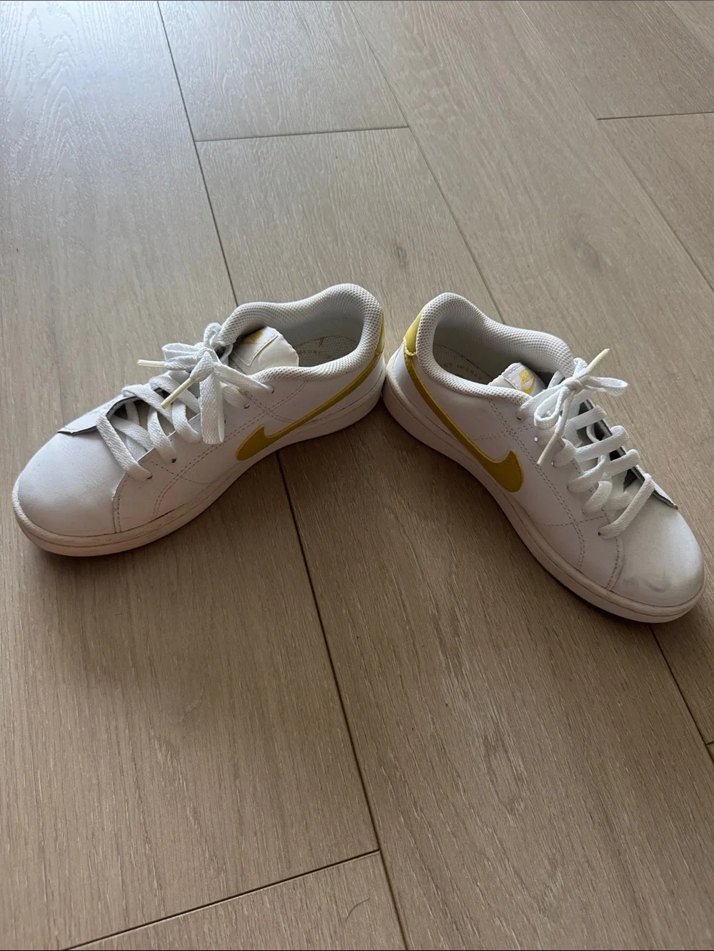 Nike White Sneakers with Yellow Swoosh